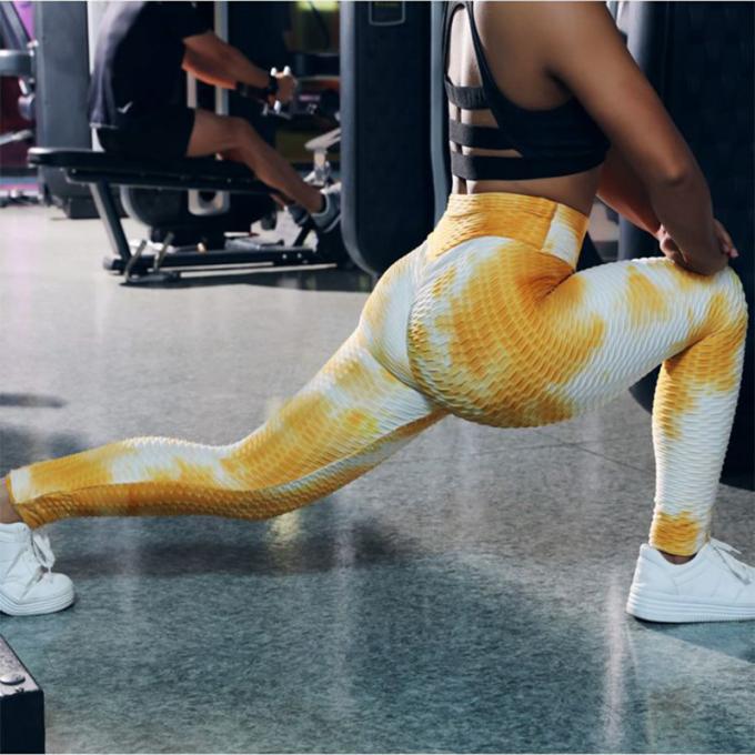 Гетры разминки оптовым управлением Tummy брюк йоги Связ-краски Stretchy текстурировали женщину гетры подъема батта Tik Tok